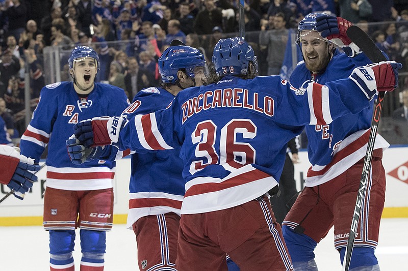 
              New York Rangers right wing Mats Zuccarello (36) celebrates with his teammates after scoring a second goal during the second period of Game 6 of a first-round NHL hockey Stanley Cup playoff series against the Montreal Canadiens, Saturday, April 22, 2017, at Madison Square Garden in New York. (AP Photo/Mary Altaffer)
            