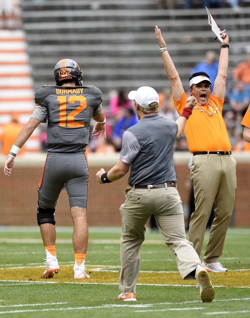 Quarterback coach Mike Canales celebrates as Quinten Dormady (12) hits the last target on the quarterback challenge.  The annual Spring Orange and White Football game was held at Neyland Stadium on April 22, 2017.