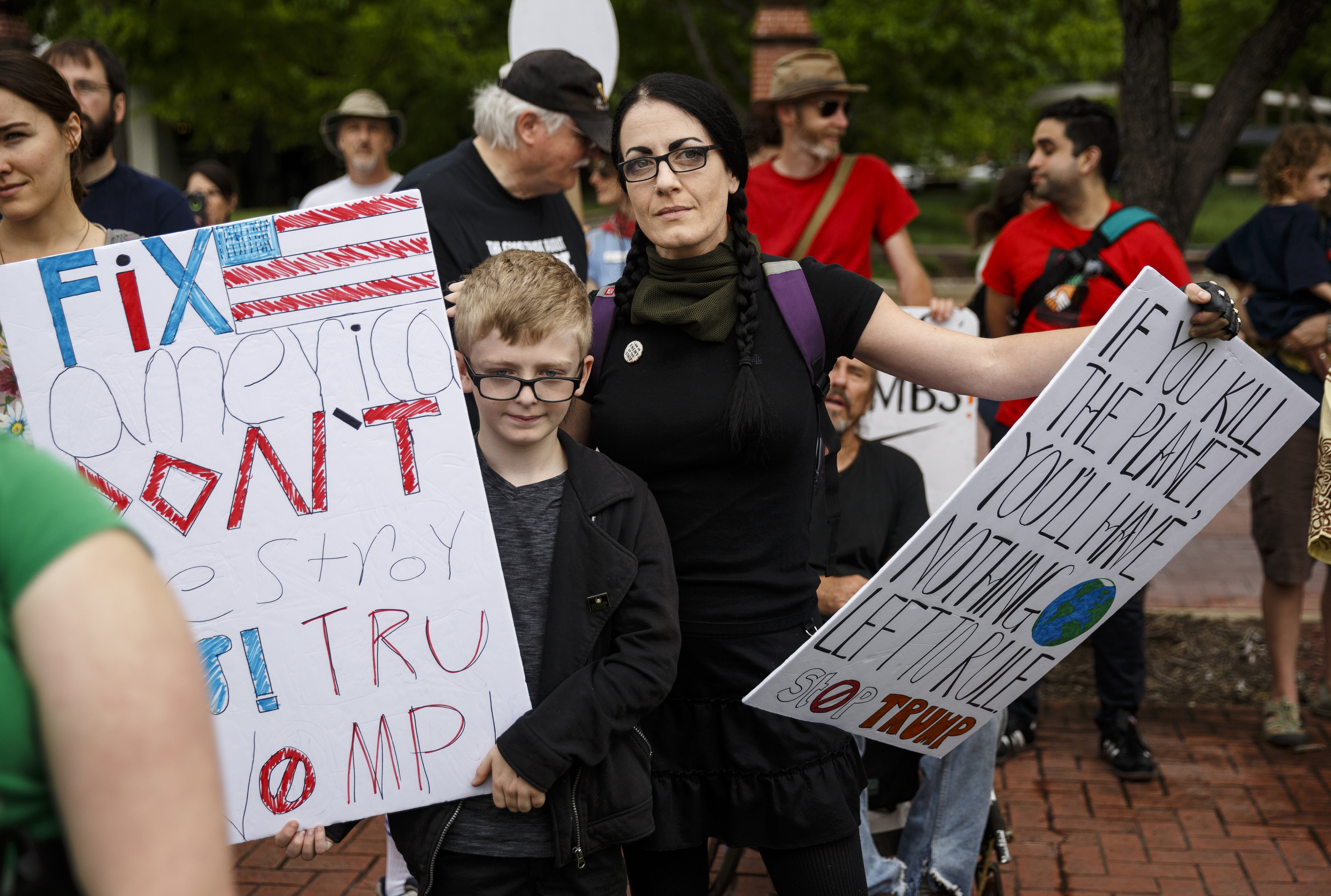 Amber Mercer, right, and her son Owen Hall listen to a speaker in the Main Terrain Art Park during the March for Science on Saturday, April 22, 2017, in Chattanooga, Tenn. About a thousand demonstrators marched from the Main Terrain Art Park to Riverfront Parkway and back in support of science and education in solidarity with other marches nationwide.