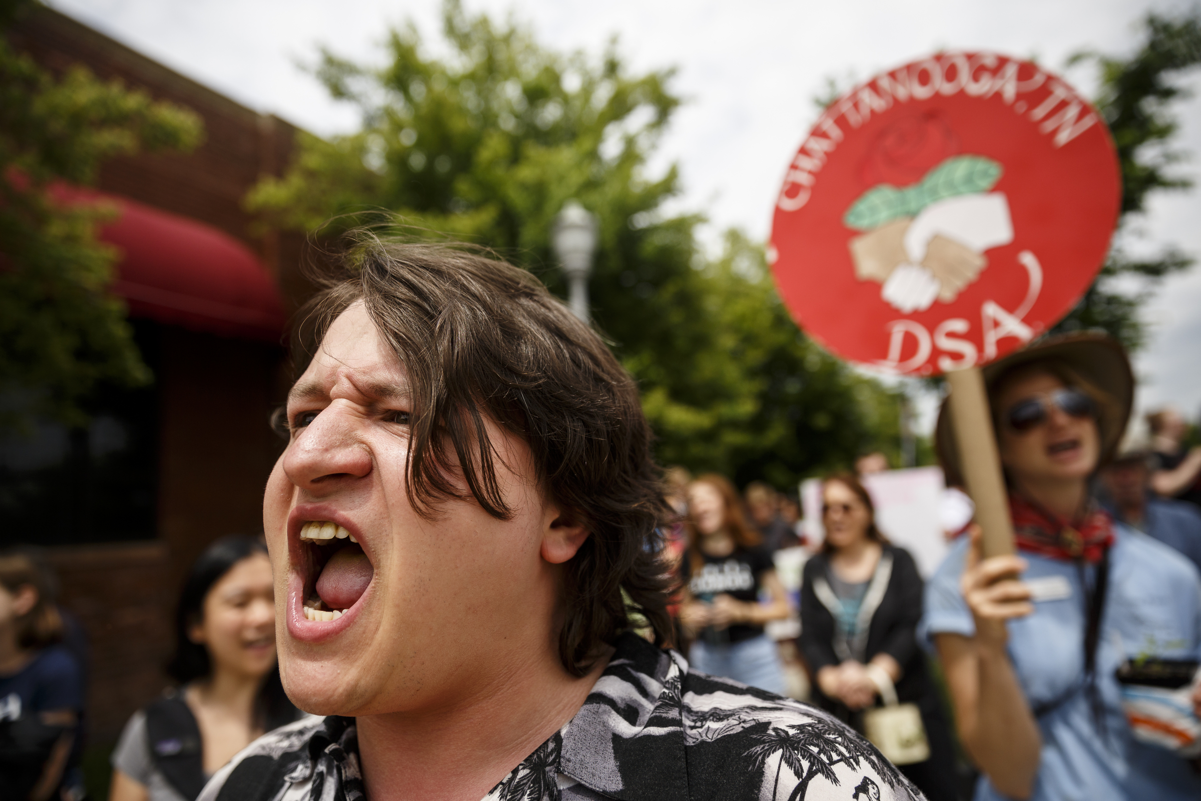 Caleb White shouts during the March for Science on Saturday, April 22, 2017, in Chattanooga, Tenn. About a thousand demonstrators marched from the Main Terrain Art Park to Riverfront Parkway and back in support of science and education in solidarity with other marches nationwide.