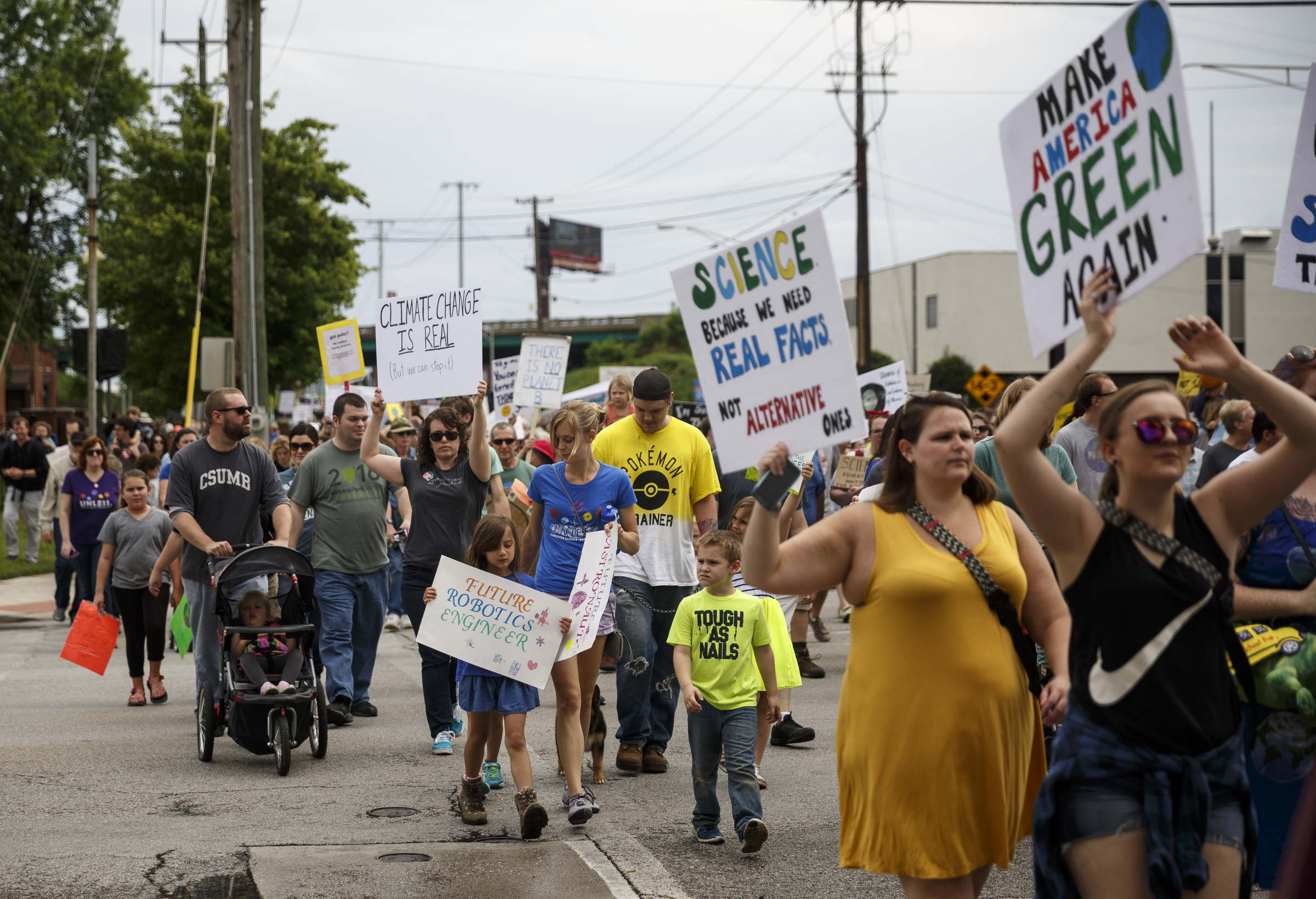 Demonstrators cross Riverside Drive on Main Street during the March for Science on Saturday, April 22, 2017, in Chattanooga, Tenn. About a thousand demonstrators marched from the Main Terrain Art Park to Riverfront Parkway and back in support of science and education in solidarity with other marches nationwide.