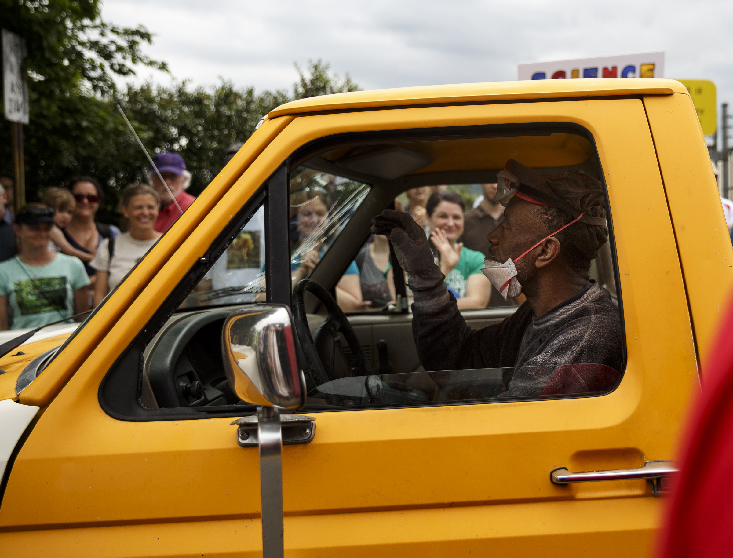 A truck driver makes his way through a crowd of demonstrators during the March for Science on Saturday, April 22, 2017, in Chattanooga, Tenn. About a thousand demonstrators marched from the Main Terrain Art Park to Riverfront Parkway and back in support of science and education in solidarity with other marches nationwide.