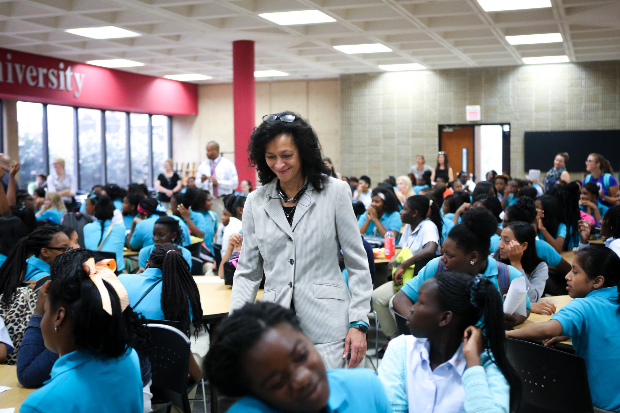 CGLA Executive Director Elaine Swafford walks through tables of her students on the first day of the 2015 school year, Aug. 6, 2015.