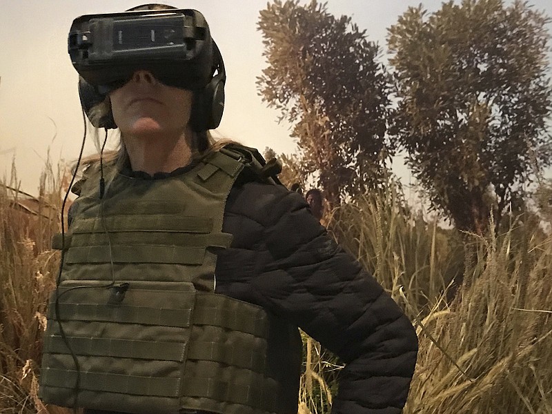 
              This Thursday, April 20, 2017 photo provided by Strategy PR shows director Kathryn Bigelow at the Tribeca Film Festival Virtual Arcade in New York. On Friday, the Oscar-winning director premiered her first VR experience, “The Protectors: Walk in the Rangers’ Shoes,” an 8-minute, 360-degree plunge into the lives of the Garamba National Park rangers in the Democratic Republic of the Congo. National Geographic will release the film May 1 on the VR app Within, and on YouTube and Facebook360 the following week. (Kathryn Bigelow/Strategy PR via AP)
            