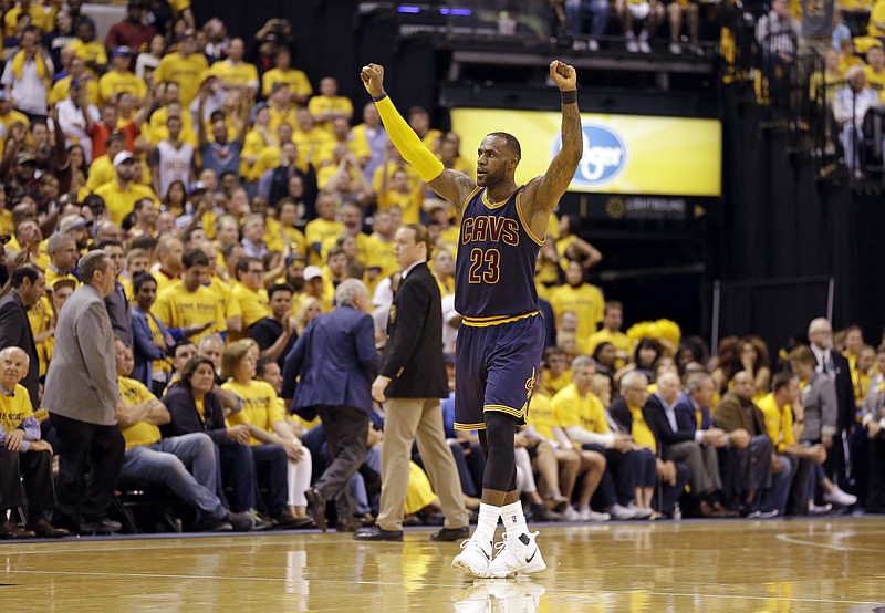 
              Cleveland Cavaliers forward LeBron James (23) celebrates a basket during the second half against the Indiana Pacers in Game 3 of a first-round NBA basketball playoff series, Thursday, April 20, 2017, in Indianapolis. The Cavaliers defeated the Pacers 119-114. (AP Photo/Michael Conroy)
            