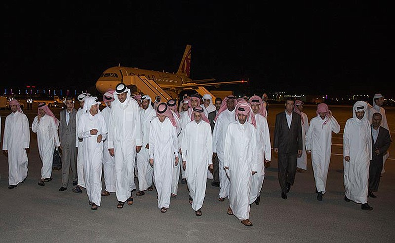 
              In this photo released by Qatar News Agency, Emir of Qatar Sheikh Tamim bin Hamad Al Thani, second left in front row, receives the released Qataris at the Doha airport in Doha, Qatar Friday, April 21, 2017. After nearly a year and a half in captivity, Qatar on Friday secured the release of 26 hostages, including members of its ruling family, in what became possibly the region's most complex and sensitive hostage negotiation deal in recent years. (Qatar News Agency via AP)
            