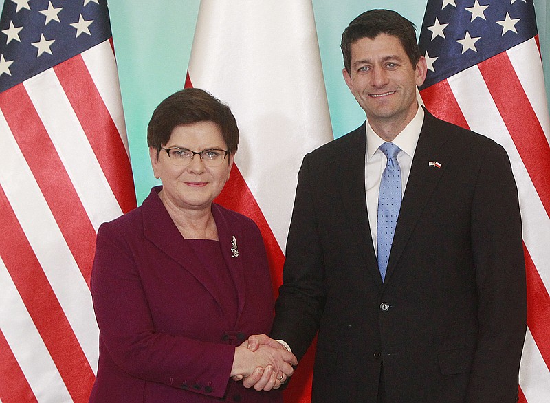 
              Poland's Prime Minister Beata Szydlo, left, greets U.S. House Speaker Paul Ryan, right, before talks at her office in Warsaw, Poland, Friday, April 21, 2017. Their talks were to focus on economic and security issues. (AP Photo/Czarek Sokolowski)
            