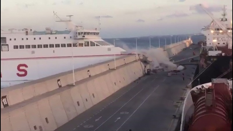 
              This image taken from video shows a Naviera Armas ferry hitting the breakwater at Puerta de la Luz, Gran Canaria, Spain on Friday, April 21, 2017. Thirteen ferry passengers were injured when the boat slammed into a breakwater in a port on the Canary Islands, Spanish authorities said Saturday. Manolo Vidal, spokesman for Naviera Armas, the company that owns the ferry, says that a "loss of electrical power" caused the accident as the boat was leaving the Puerta de la Luz on the island of Gran Canaria Friday night. (EMERGCAN via AP)
            