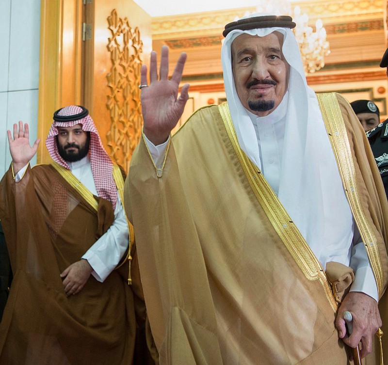 
              FILE -- In this Wednesday, April 5, 2017 file photo, released by the Saudi Press Agency, SPA, Saudi King Salman, right, and Defense Minister and Deputy Crown Prince Mohammed bin Salman wave as they leave the hall after talks with the British prime minister, in Riyadh, Saudi Arabia. King Salman  issued a decree late Saturday, April 22, 2017, reinstating public sector perks after a drop in oil prices forced the kingdom to curb big-ticket spending and implement sensitive austerity measures. The decree states that King Salman has reinstated all allowances, privileges and financial premiums given to civil and military officials. (Saudi Press Agency via AP, File)
            