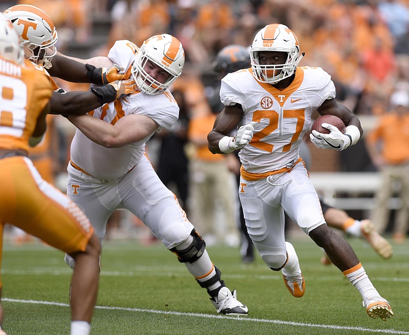 Carlin Fils-aime (27) runs behind the block of Tyler Byrd (10).  The annual Spring Orange and White Football game was held at Neyland Stadium on April 22, 2017.