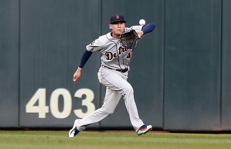 
              Detroit Tigers center fielder JaCoby Jones eyes the ball hit by Minnesota Twins' Brian Dozier, before making the catch for the out during the first inning of a baseball game Friday, April 21, 2017, in Minneapolis. (AP Photo/Jim Mone)
            