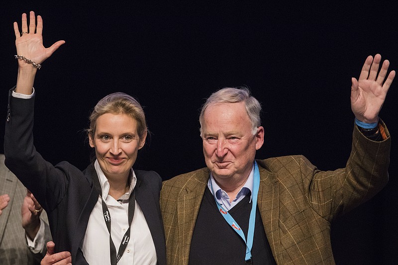 
              Alice Weidel, left, and Alexander Gauland, members of the AfD (Alternative for Germany) wave to the delegates during the party convention in Cologne, Germany, Sunday, April 23, 2017. The delegates elected Weidel and Gauland as new top candidates for the September general election on Sunday, after the party’s best-known politician, Frauke Petry, said she would no longer be available. (Rolf Vennenbernd//dpa via AP)
            