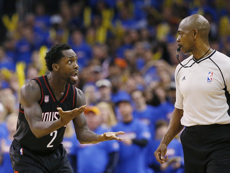 
              Houston Rockets guard Patrick Beverley (2) questions official Tom Washington, right, during the fourth quarter of the team's first-round NBA basketball playoff game against the Oklahoma City Thunder in Oklahoma City, Friday, April 21, 2017. Oklahoma City won 115-113. (AP Photo/Sue Ogrocki)
            