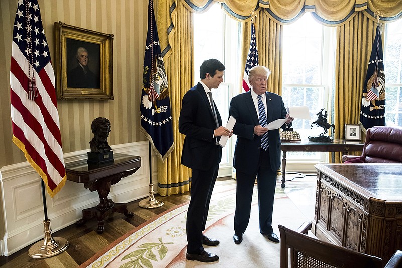 
              President Donald Trump speaks to White House Senior Adviser Jared Kushner, left, in the Oval Office in Washington, Friday, April 21, 2017. With his tweets and his bravado, Trump is putting his mark on the presidency in his first 100 days in office. He's flouted conventions of the institution by holding on to his business, hiring family members as advisers and refusing to release his tax returns. He's tested conventional political wisdom by eschewing travel, church, transparency, discipline, consistency and decorum. But the presidency is also having an impact on Trump, prompting him, at times, to  play the role of traditional president. (AP Photo/Andrew Harnik)
            