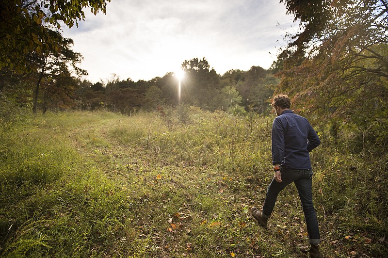 
              In this Monday, Oct. 10, 2016 photo, John Christian Phifer walks while giving a tour of the proposed site of Tennessee's first conservation cemetery, in Westmoreland, Tenn. (Andrew Nelles /The Tennessean via AP)
            