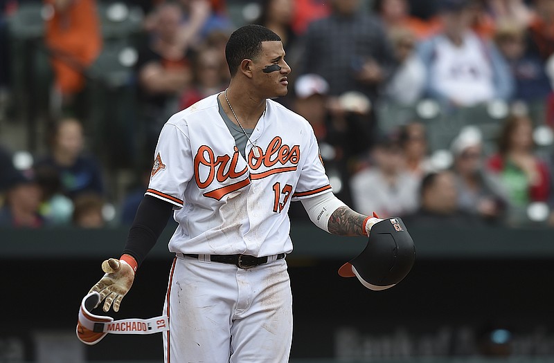 
              Baltimore Orioles Manny Machado looks to the mound after a pitch was thrown near his head by Boston Red Sox pitcher Matt Barnes during the eighth inning of a baseball game, Sunday, April 23, 2017, in Baltimore. (AP Photo/Gail Burton)
            