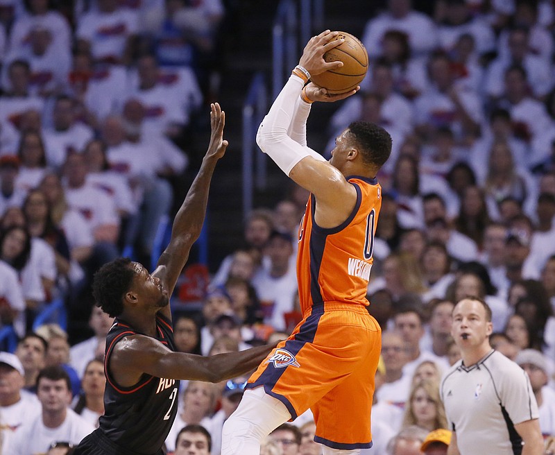 
              Oklahoma City Thunder guard Russell Westbrook (0) shoots over Houston Rockets guard Patrick Beverley (2) in the first quarter of Game 4 of a first-round NBA basketball playoff series in Oklahoma City, Sunday, April 23, 2017. (AP Photo/Sue Ogrocki)
            