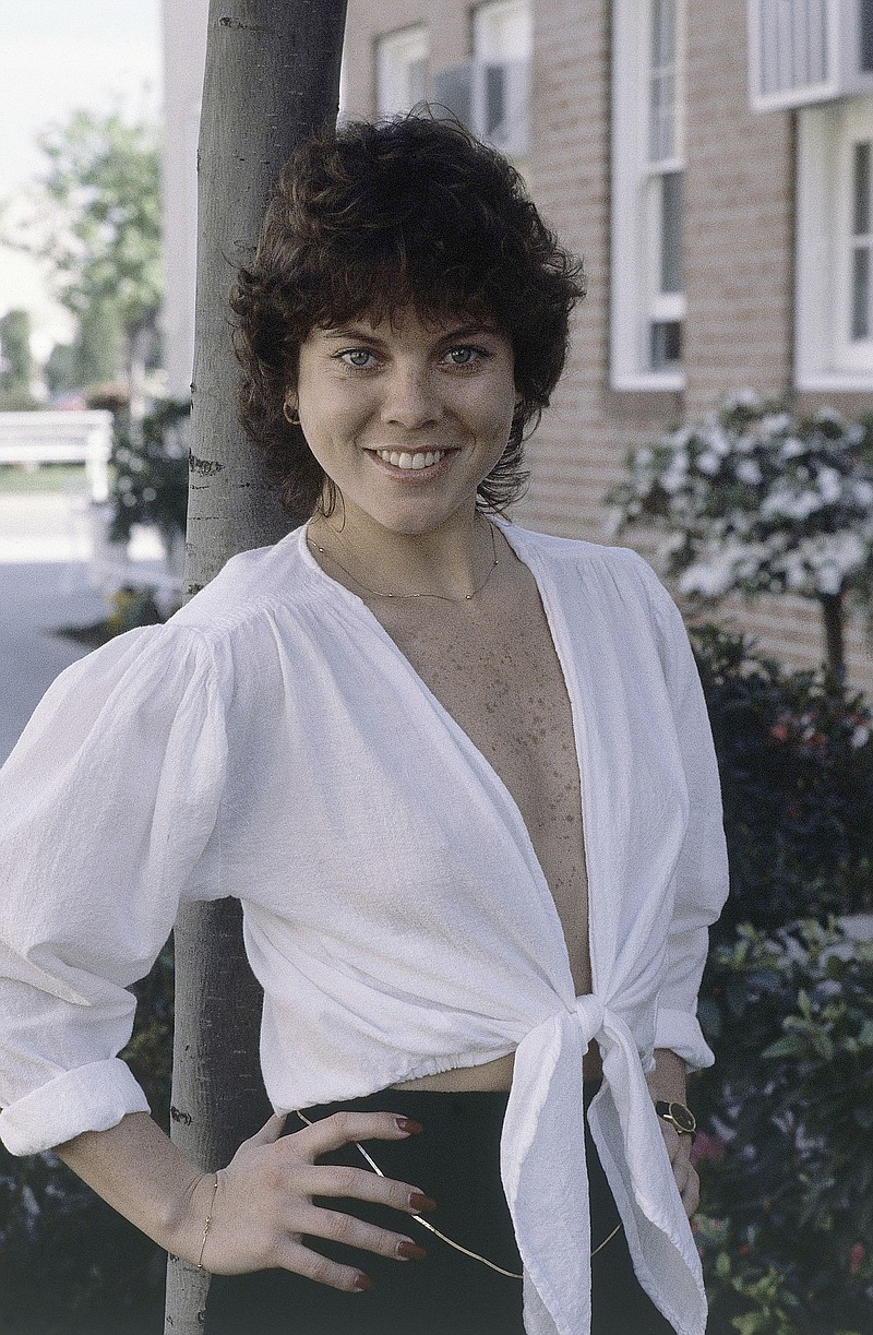 
              FILE - This Feb. 19, 1982 file photo shows actress Erin Moran of the television show, "Happy Days" in Los Angeles. Moran, the former child star who played Joanie Cunningham in the sitcoms "Happy Days" and "Joanie Loves Chachi," has died at age 56. Police in Harrison County, Indiana said that she had been found unresponsive Saturday, April 22, 2017, after authorities received a 911 call. (AP Photo/Wally Fong, File)
            