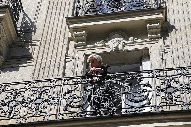
              French far-right leader and candidate for the 2017 presidential election Marine Le Pen appears on the balcony of her campaign headquarters in Paris, Monday, April 24, 2017. French president Francois Hollande has urged voters to choose centrist candidate Emmanuel Macron in the May 7 presidential runoff to keep out far-right leader Marine Le Pen. (AP Photo/Michel Euler)
            