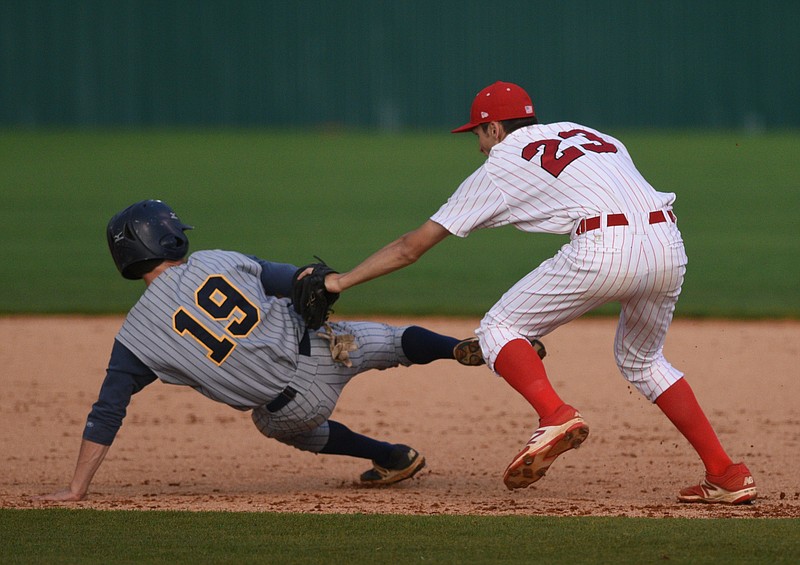 Ooltewah's Daniel Willie runs down Walker Valley's Jacob McCall between first and second base Monday, April 24, 2017, at Ooltewah High School.