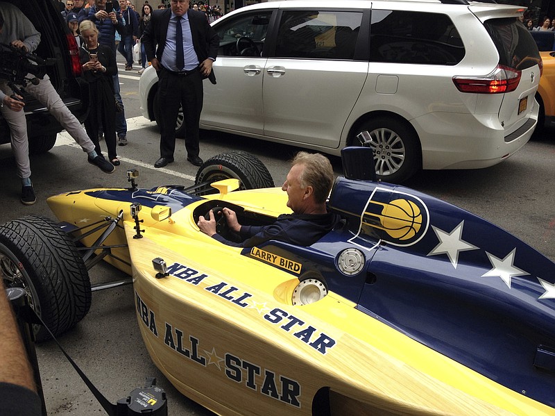 
              Indiana Pacers president Larry Bird sits in an Indy car in New York, Monday, April 24, 2017. Bird drove four blocks down Fifth Avenue in the car to deliver the basketball team's bid to host the 2021 game to NBA Commissioner Adam Silver, fitting his 6-foot-9 frame into a car usually driven by much shorter people. (AP Photo/Brian Mahoney)
            