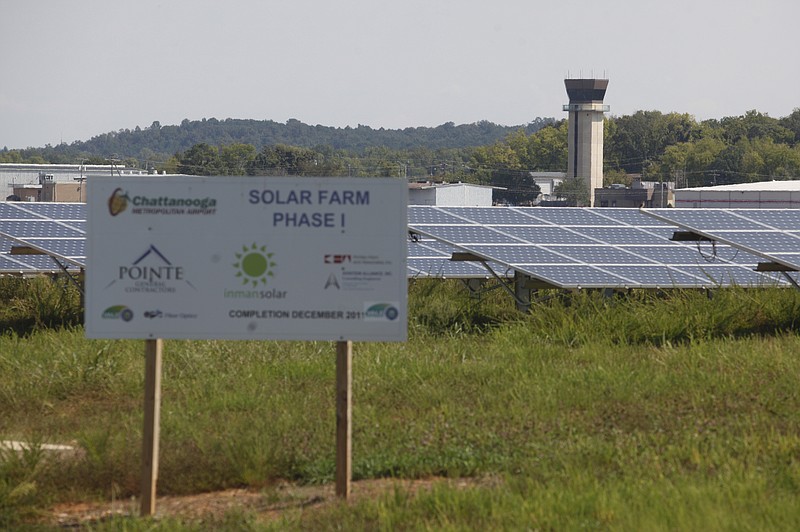 Staff file photo by Jake Daniels/A sign designates rows of photovoltaic cells at Chattanooga Metropolitan Airport's solar farm. The solar array could get larger if airport officials approve another phase.