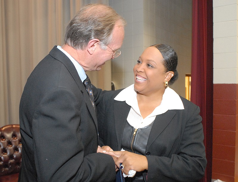 Then-Hamilton County Commissioner Larry Henry congratulates then-Hardy Elementary School principal Natalie Elder after she was presented with an outstanding educator award in 2006. Elder is one of 14 candidates for superintendent of Hamilton County Schools.