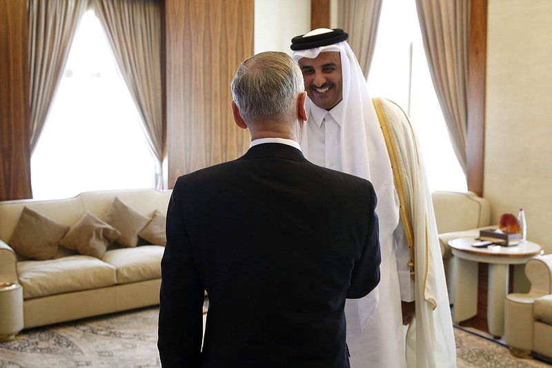 
              Qatar's Emir Sheikh Tamim Bin Hamad Al-Thani, right, greets U.S. Defense Secretary Jim Mattis at his residence, the Sea Palace, in Doha, Qatar, Saturday, April 22, 2017. (Jonathan Ernst/Pool Photo via AP)
            