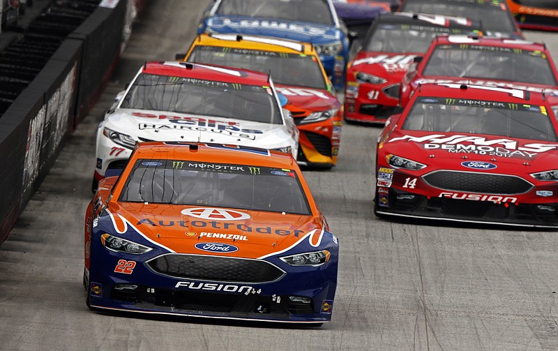 
              Joey Logano (22) leads the field during a NASCAR Monster Energy NASCAR Cup Series auto race, Monday, April 24, 2017, in Bristol, Tenn. (AP Photo/Wade Payne)
            