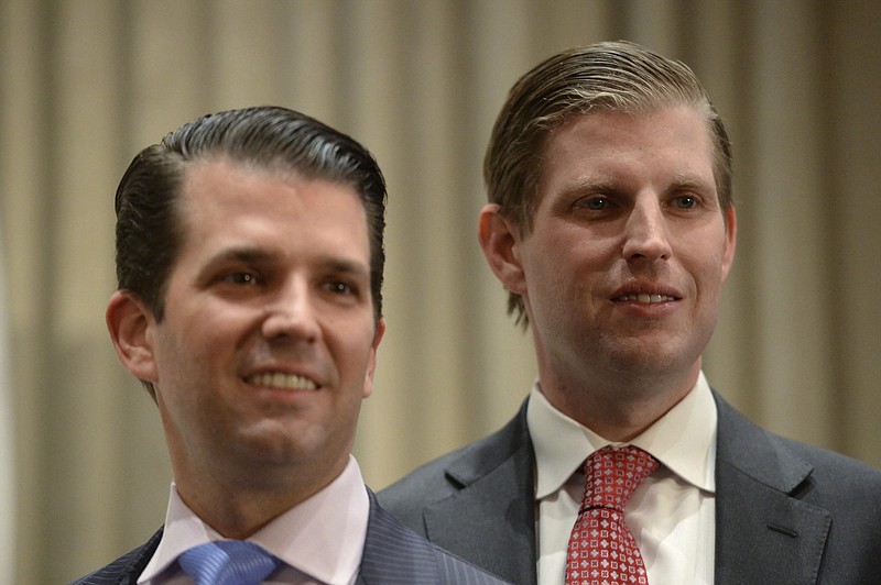 
              FILE- In this Feb. 28, 2017 file photo, Donald Trump Jr., left, and his brother Eric Trump attend the grand opening of the Trump International Hotel and Tower in Vancouver, B.C., Canada. Apprentices no more, Eric Trump and Donald Trump Jr. are now at the helm of the Trump Organization and adjusting to the reality presented by their father's presidency. (Jonathan Hayward/The Canadian Press via AP, File)
            