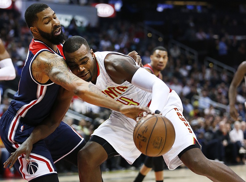 
              Atlanta Hawks forward Paul Millsap (4) works against Washington Wizards forward Markieff Morris (5) in the first half in Game 4 of a first-round NBA basketball playoff series Monday, April 24, 2017, in Atlanta. (AP Photo/John Bazemore)
            