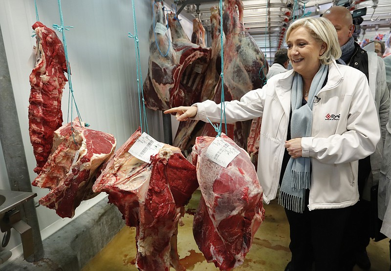 
              Marine Le Pen, National Front political party candidate for French 2017 presidential election, visits the meat pavilion at the Rungis international food market, near Paris, France, during her campaign, Tuesday, April 25, 2017. (Charles Platiau/Pool Photo via AP)
            