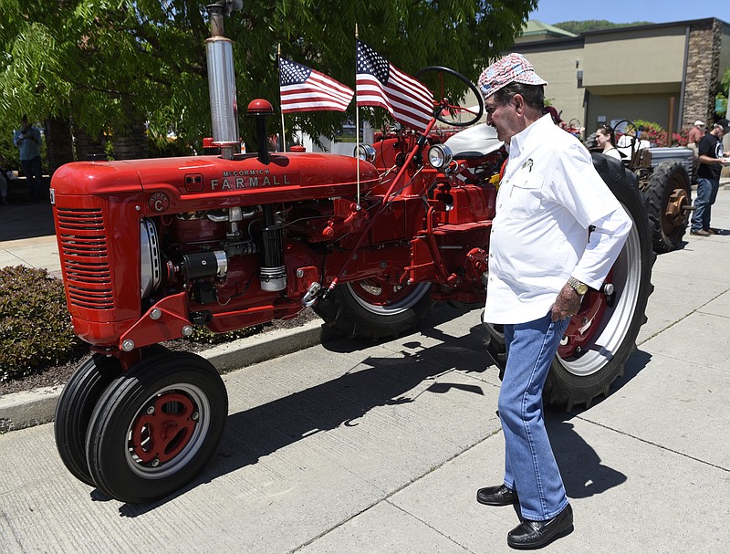 Tom Gracy checks out the 1951 McCormick tractor that was displayed at last year's National Cornbread Festival.