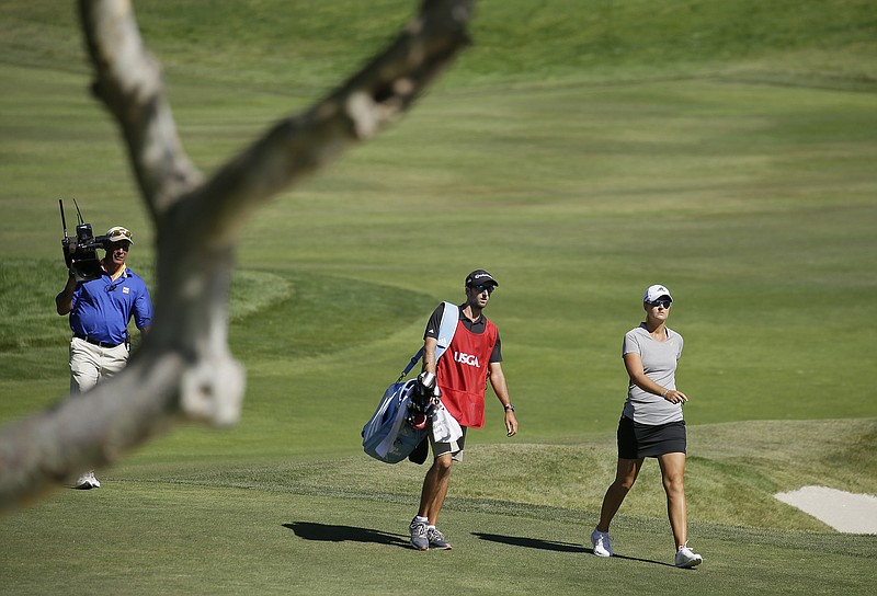 
              FILE - In this July 10, 2016, file photo, Anna Nordqvist, of Sweden, walks to the green after hitting out of a bunker on the second playoff hole of the U.S. Women's Open golf tournament at CordeValle, in San Martin, Calif.  Nordqvist was penalized for clipping sand during a bunker shot in the final round. Golf’s ruling bodies issued a new guideline Tuesday that limits the use of video evidence in determining rules violations. (AP Photo/Eric Risberg, File)
            