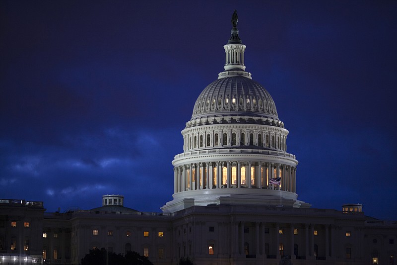 
              FILE - In this April 4, 2017, file photo, the Capitol is seen at dawn in Washington. Bipartisan bargainers are making progress toward a budget deal to prevent a partial federal shutdown this weekend, a major hurdle overcome when President Donald Trump signaled he would put off his demand that the measure include money to build his border wall with Mexico. (AP Photo/J. Scott Applewhite, File)
            