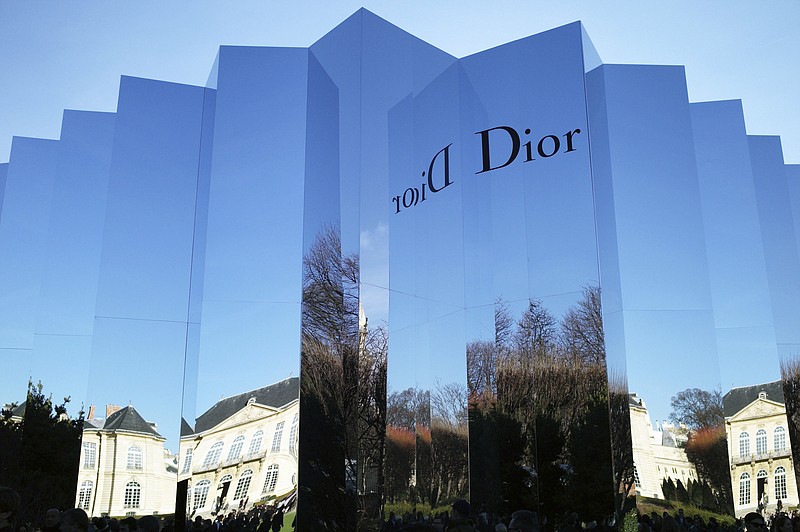 
              FILE - In this Jan.25, 2016 file photo, the Rodin museum, venue for Christian Dior's Spring- Summer 2016 Haute Couture fashion collection, is reflected in Paris. The magnate behind the LVMH luxury empire is seeking to strengthen control over Christian Dior in a multibillion-dollar deal combining the fashion industry heavyweights. (AP Photo/Thibault Camus, File)
            