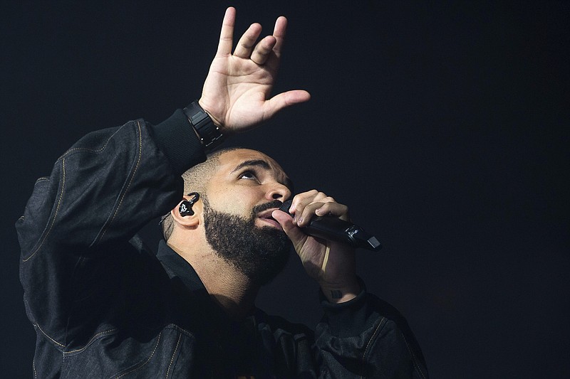 
              FILE - In this Aug. 5, 2016, file photo, Drake performs in concert as part of the Summer Sixteen Tour at Madison Square Garden in New York.  Drake was the world's most popular recording artist in 2016, as the growth of music streaming gave global music sales their biggest boost in 20 years. The International Federation of the Phonographic Industry said Tuesday, April 25, 2017 that Drake had the years' best-selling single, with "One Dance," and the third best-selling album, "Views." ?? ?(Photo by Charles Sykes/Invision/AP, File)
            