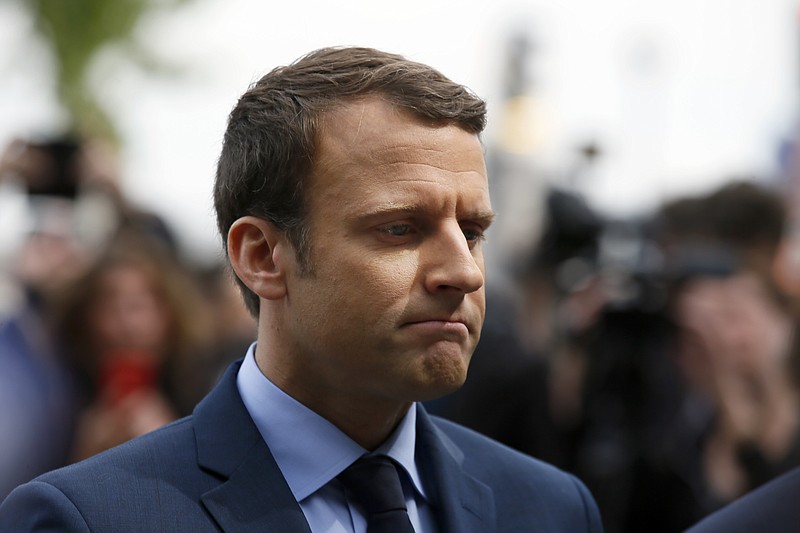 
              French centrist presidential candidate Emmanuel Macron pays respect during a ceremony marking 102nd anniversary of the slaying of Armenians by Ottoman Turks in a brief ceremony, Monday April 24, 2017 in Paris. Macron, a centrist with pro-business, pro-European views, will face far-right leader Marine Le Pen in the May 7 runoff of the presidential election. (AP Photo/Francois Mori)
            