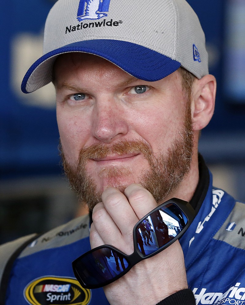 
              FILE - In this Feb. 20, 2016, file photo, Dale Earnhardt Jr looks from the garage before practice at Daytona International Speedway in Daytona Beach, Fla. Hendrick Motorsports says Dale Earnhardt Jr. will retire at the end of this season. (AP Photo/Wilfredo Lee, File)
            