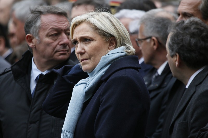 
              French far-right leader and presidential candidate Marine le Pen waits before a national homage to slain police officer Xavier Jugele, in the courtyard of the Paris Police headquarters, Tuesday, April 25, 2017. A gunman shot and killed Jugele last Thursday on the famed Champs-Elysees just days before the first round of the French presidential vote. (AP Photo/Francois Mori)
            