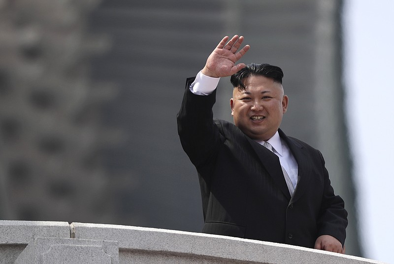 
              In this Saturday, April 15, 2017, photo, North Korean leader Kim Jong Un waves during a military parade to celebrate the 105th birth anniversary of Kim Il Sung in Pyongyang, North Korea. The broad avenues of Pyongyang were, by authoritarian North Korea’s standards, fairly empty ahead of Tuesday’s 85th anniversary of the founding of the Korean People’s Army, one of the biggest events on the country’s calendar. In recent years, the army commemoration has taken a backseat to the April 15th celebration of North Korea founder Kim Il Sung’s birth, which saw thousands choking the avenues to prepare for the country’s biggest holiday. (AP Photo/Wong Maye-E)
            