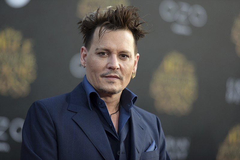
              FILE - In this May 23, 2016, file photo, Johnny Depp arrives at the premiere of "Alice Through the Looking Glass" at the El Capitan Theatre, in Los Angeles. Depp's former business managers called him a "habitual liar" in a statement on April 26, 2017. The managers were responding to Depp's criticism of them in The Wall Street Journal. (Photo by Richard Shotwell/Invision/AP, File)
            