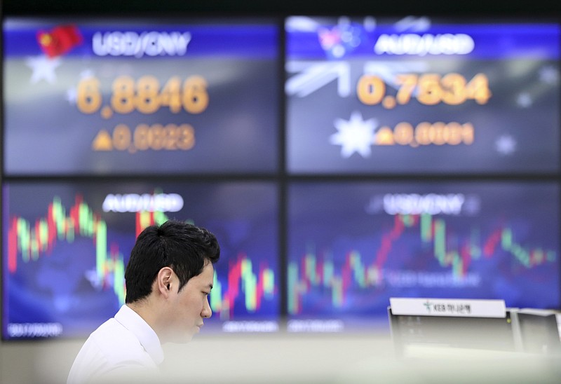 
              A currency trader watches monitors near screens showing the foreign exchange rates at the foreign exchange dealing room in Seoul, South Korea, Wednesday, April 26, 2017. Asian stocks marched higher on Wednesday as expectations for the impending tax cuts by U.S. President Donald Trump and the record-breaking gains overnight on Wall Street boosted investor sentiment. (AP Photo/Lee Jin-man)
            