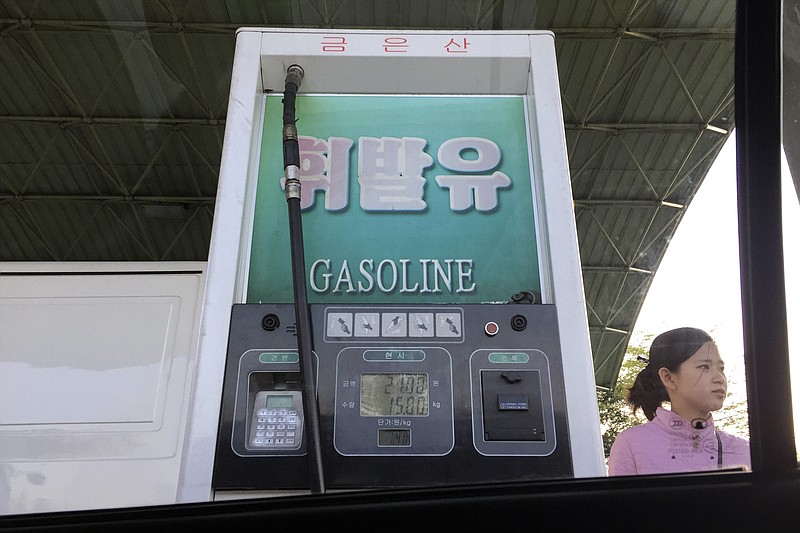 
              In this April 26, 2017, photo, a gas attendant waits by a pump at a gas station in Pyongyang, North Korea. Gas sales have been restricted in the North Korean capital for about a week with no official explanation, raising concerns over when the the situation will return to normal. (AP Photo/Eric Talmadge)
            