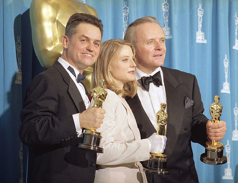 
              FILE - In this May 31, 1992 file photo, director Jonathan Demme, left, holds his award for best director, actress Jodie Foster holds her award for best actress, and actor Anthony Hopkins holds his award for best actor for their work on "Silence of the Lambs," at the Academy Awards in Los Angeles. Demme died, Wednesday, April 26, 2017, from complications from esophageal cancer in New York. He was 73. (AP Photo/Reed Saxon, File)
            