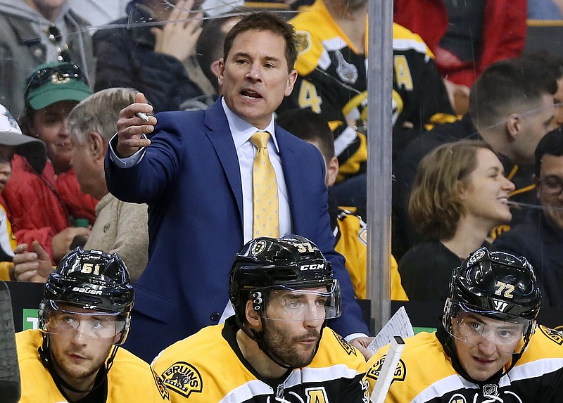 
              FILE - In this April 8, 2017, file photo, Boston Bruins interim head coach Bruce Cassidy works behind the bench in the third period of an NHL hockey game against the Washington Capitals. The Bruins said on Wednesday, April 26, 2017, it will drop the interim tag and Cassidy will return next season as the team's head coach. Cassidy replaced Claude Julien in February and helped the team return to the playoffs for the first time in three seasons. (AP Photo/Winslow Townson, File)
            
