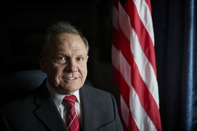 In this Feb. 17, 2015, file photo, Alabama Chief Justice Roy Moore poses for a photo in Montgomery, Ala. Moore scheduled a news conference Wednesday, April 26, 2017, on the steps of the Alabama Capitol to announce his plans for the future. (AP Photo/Brynn Anderson, File)