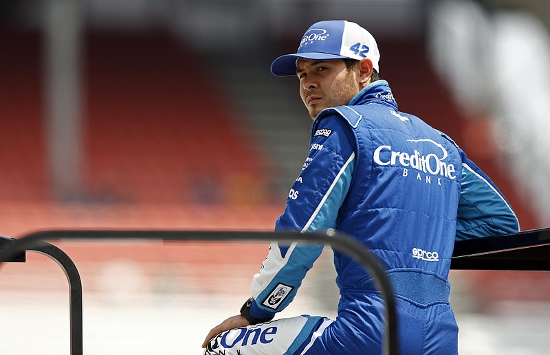 
              Driver Kyle Larson watches during practice for a NASCAR Xfinity Series auto race, Friday, April 21, 2017 in Bristol, Tenn. NASCAR officials announced because of weather, the field for Sunday's Monster Cup race will set by points. Larson is the current points leader and will be on the pole. (AP Photo/Wade Payne)
            