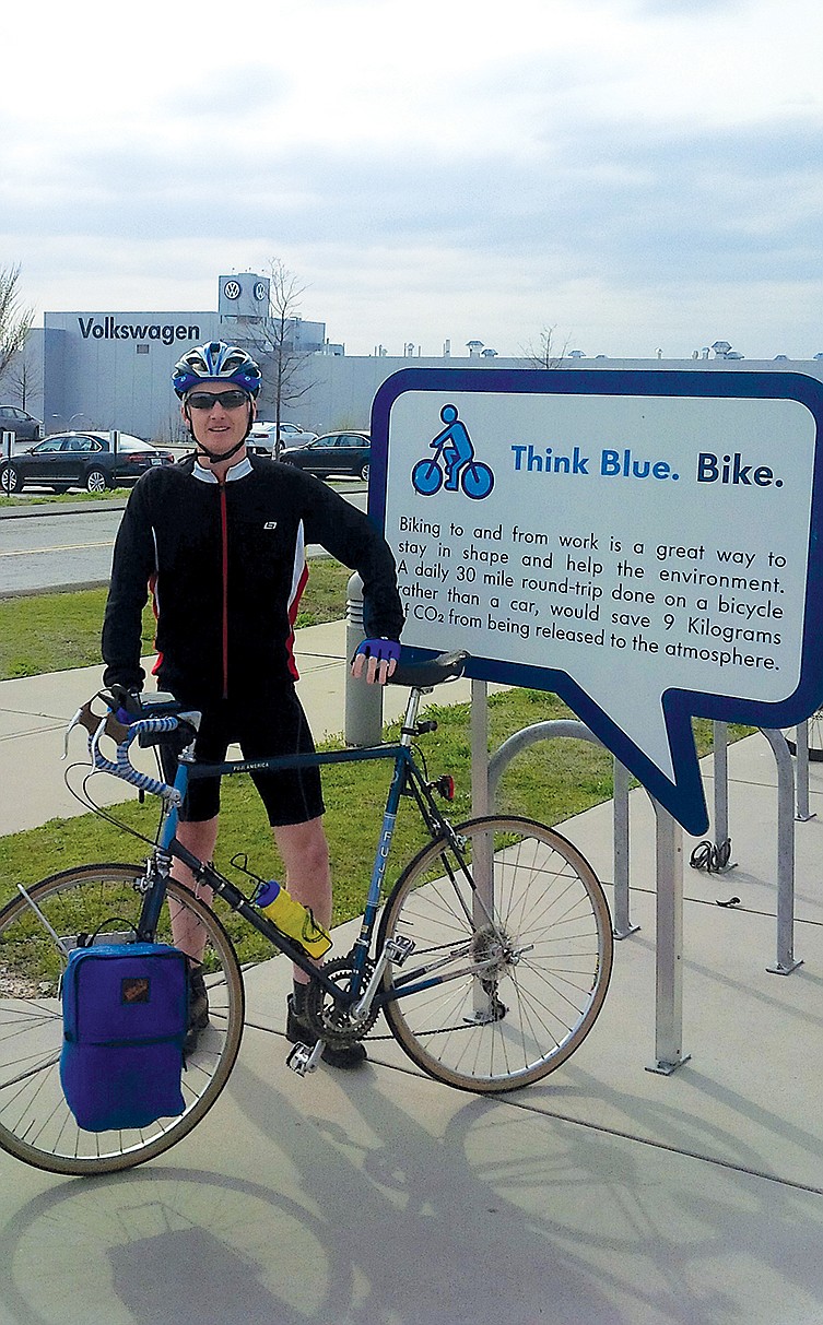 John Marshall stands by the bike rack at the Volkswagen plant where he works.