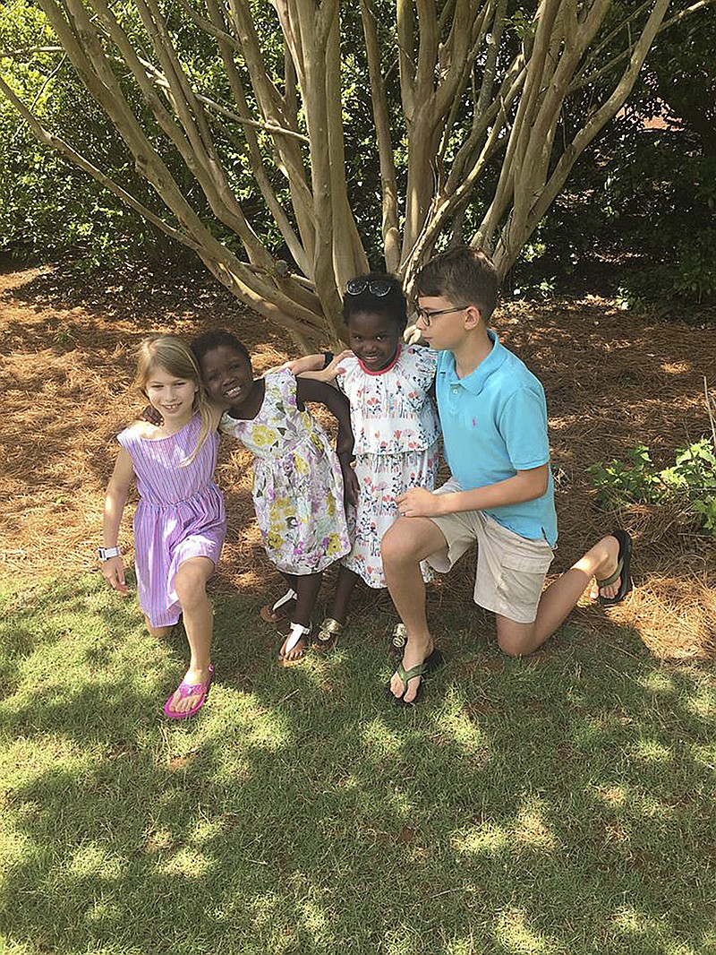 
              This April 15, 2017 photo provided by the family shows the four children of Josh and Laura Beth Christian in their hometown of Greenville, S.C.. From left are Emme Sue, 8; Tula, 4; Lola, 6, and Camden, 11. Tula and Lola were adopted from Uganda in 2017, although the process was delayed after the U.S. State Department shut down European Adoption Consultants, the adoption agency that the Christians had been using. The agency was accused of extensive improprieties in its operations. (Josh Christian via AP)
            